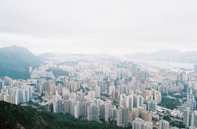 High angle view of modern buildings in city against sky