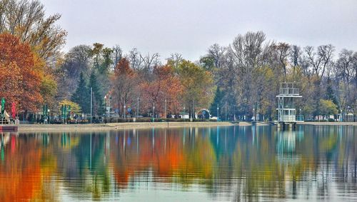 Scenic view of lake against clear sky during autumn