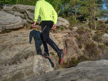 Full length of man skateboarding on rock