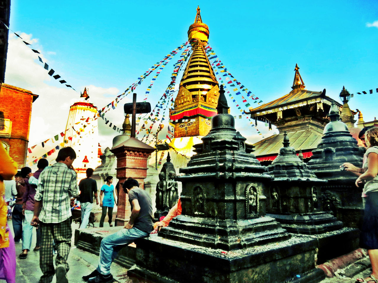 low angle view, architecture, place of worship, built structure, building exterior, religion, spirituality, temple - building, blue, cultures, clear sky, tradition, ornate, temple, sky, outdoors, day, famous place, art and craft