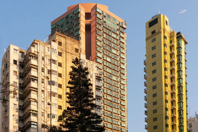 Low angle view of modern buildings against sky