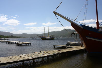 Boats moored at harbor