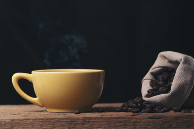 Close-up of coffee cup on table