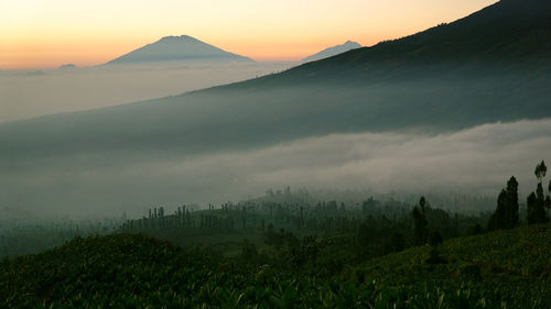 Scenic view of mountains against sky during sunset