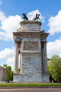 Low angle view of statue against cloudy sky