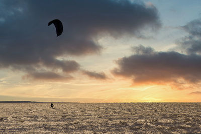 Kitesurfing during sunset