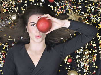 Portrait of young woman with red berries