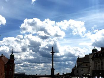 Low angle view of building against cloudy sky