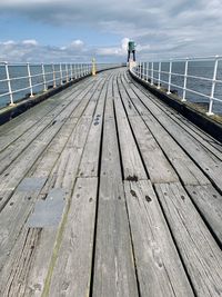 Pier over sea against sky