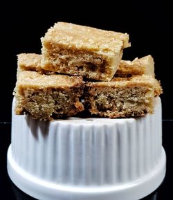 Close-up of cake against black background