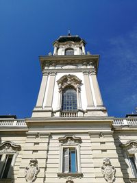 Low angle view of clock tower against sky