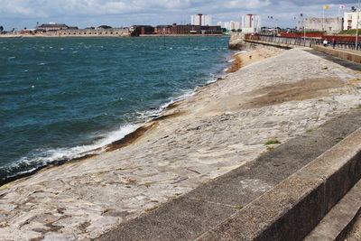 View of beach with city in background