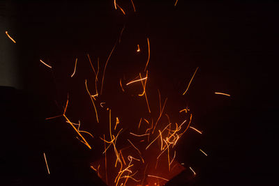 Close-up of illuminated fire in the dark