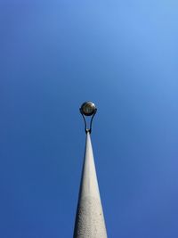 Low angle view of street light against clear blue sky