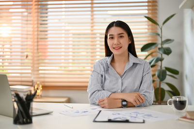 Portrait of businesswoman working at office