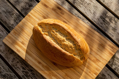 High angle view of bread on cutting board