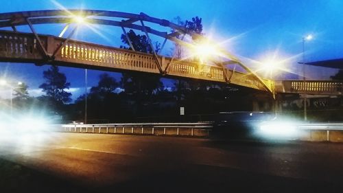 Sun shining through bridge