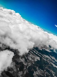 Aerial view of clouds over mountain