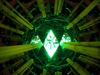 Low angle view of illuminated sign at night