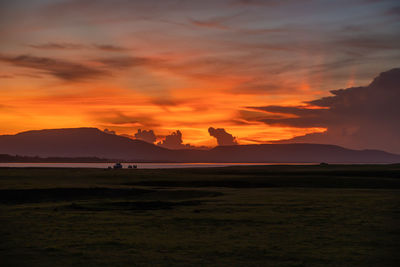 Scenic view of silhouette landscape against sky during sunset