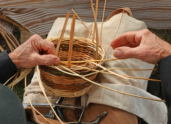 High angle view of man holding basket