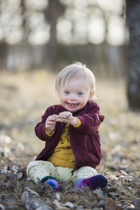 Smiling toddler with down syndrome looking at camera