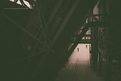Low angle view of illuminated bridge in building