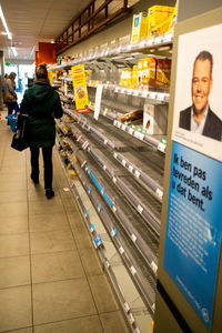 Rear view of man standing in store