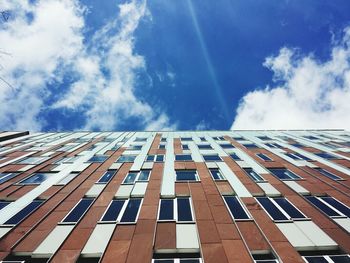 Low angle view of building against cloudy sky