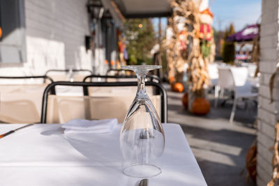 Close-up of wineglass on table at sidewalk cafe