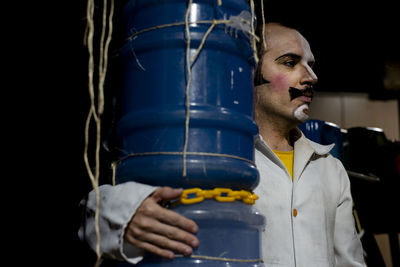 Actor standing on stage before theatrical performance.