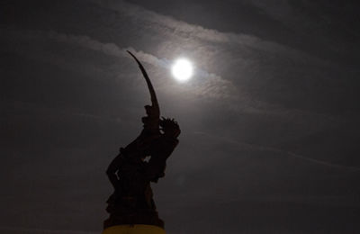 Low angle view of statue against cloudy sky