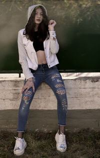 Portrait of young woman standing outdoors