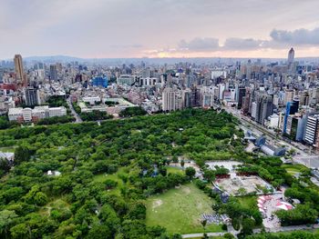 High angle view of modern buildings in city against sky