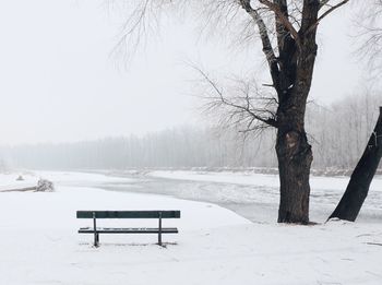 Scenic view of frozen lake against sky during winter