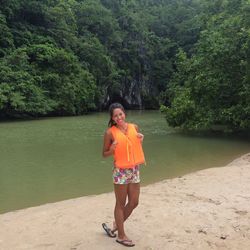 Full length of woman standing in water