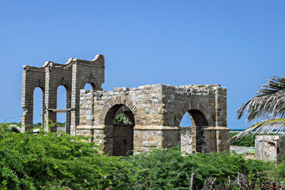 Remains of stone made dhanushkodi railway station and its water tank. tamil nadu.