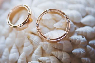 Close-up of wedding rings on table