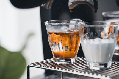 Close-up of coffee in glass on table