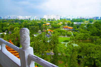 View of trees and buildings against sky