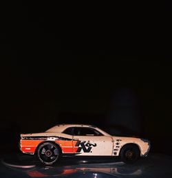 Close-up of toy car against black background