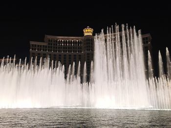 View of fountain in city at night