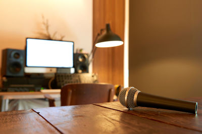 Close-up of microphone on table