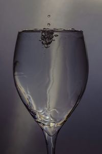 Close-up of wineglass on white background