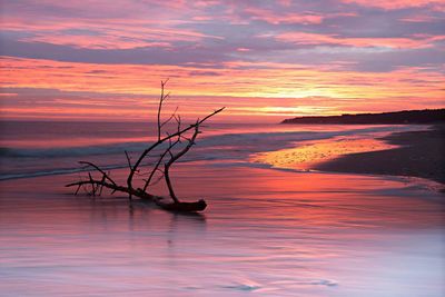 Scenic view of sea against romantic sky