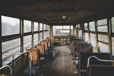 Empty vehicle seats in abandoned bus