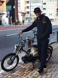 Man riding motorcycle on street