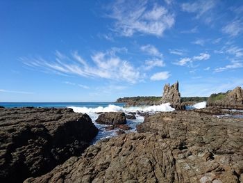 Scenic view of sea against cloudy sky