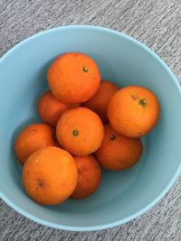 High angle view of oranges in bowl on table