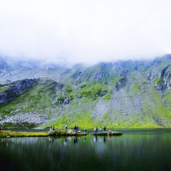 Scenic view of lake with mountains in background